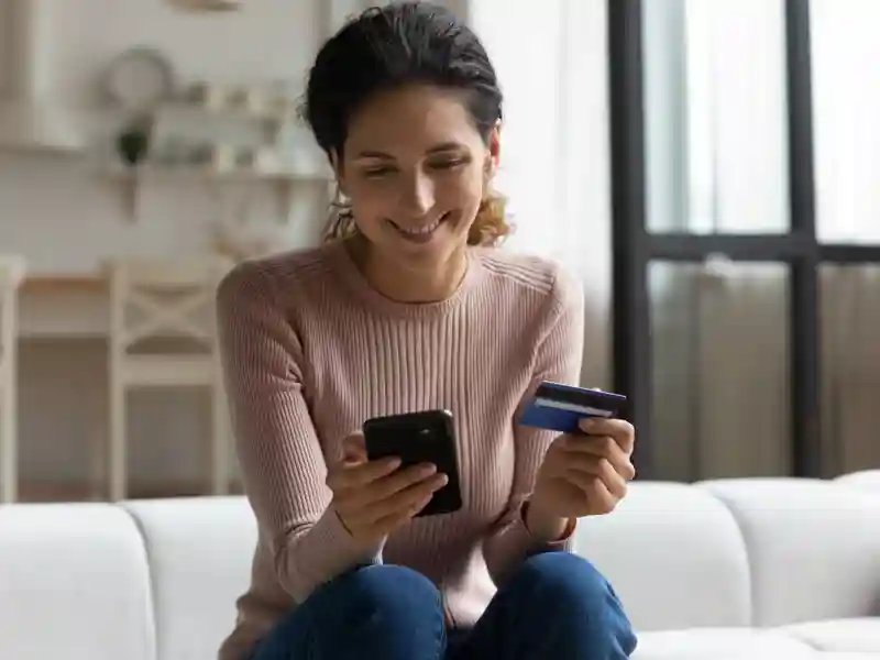 Happy young woman enjoy easy fast secure transferring money in bank app.
